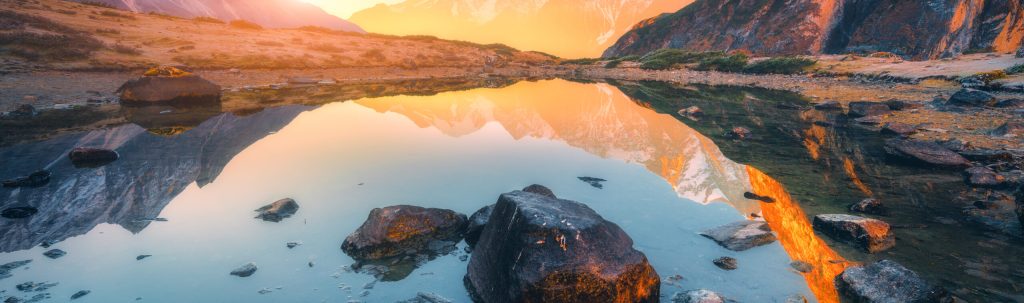 Beautiful,Landscape,With,High,Mountains,With,Illuminated,Peaks,,Stones,In